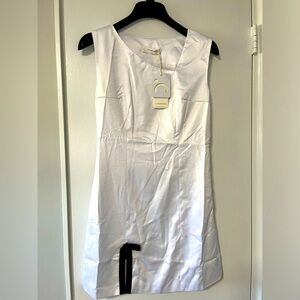 Asymmetrical satin white dress with black bow